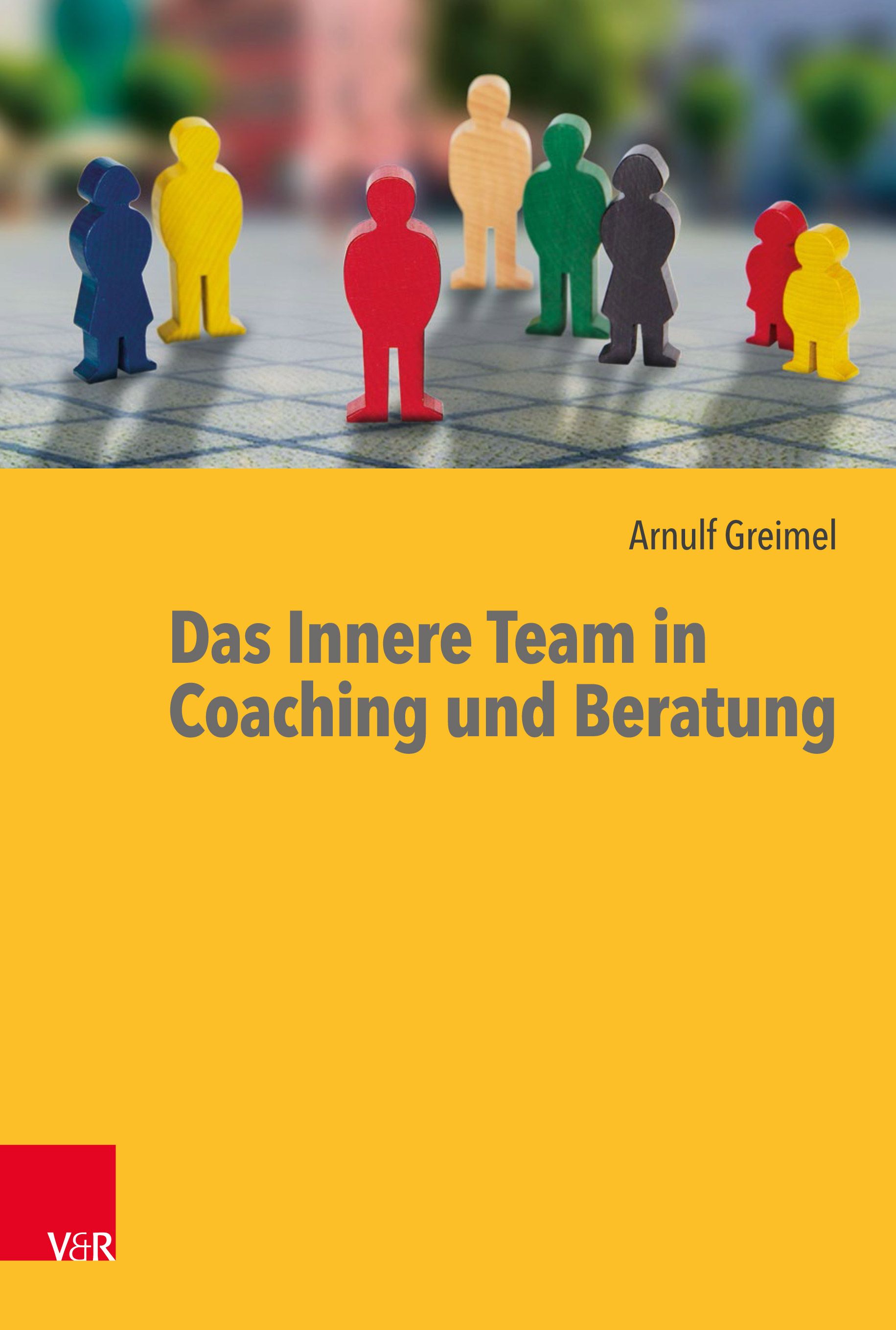 Buchcover mit farbigen Holzfiguren. Titel: Das Innere Team in Coaching und Beratung. Autor: Arnulf Greimel. Verlag V&R.