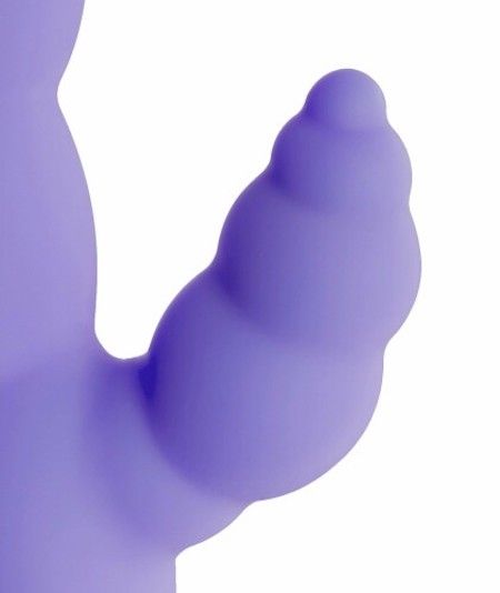 Nahaufnahme eines lila Vibrator-Aufsatzes mit geriffelter Oberfläche.