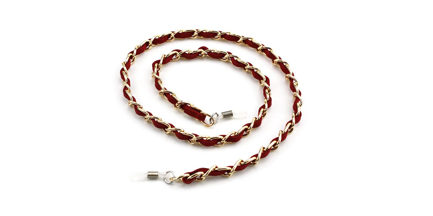 Brillenkette mit rotem Stoff und goldfarbenen Kettengliedern. Enden mit transparenten Schlaufen.