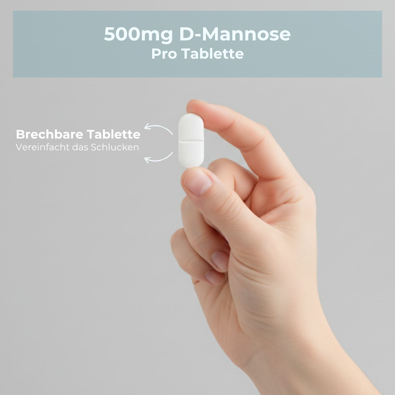 Hand hält eine weiße, teilbare Tablette. Text: "500mg D-Mannose Pro Tablette". "Brechbare Tablette vereinfacht das schlucken".