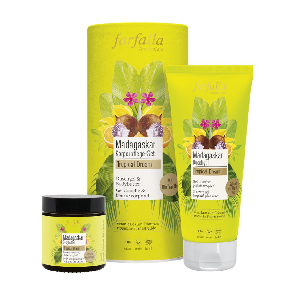 Körperpflege-Set mit Duschgel, Bodybutter und einem zylindrischen Behälter. Aufschrift: Madagaskar Tropical Dream. Gelbe Verpackung.