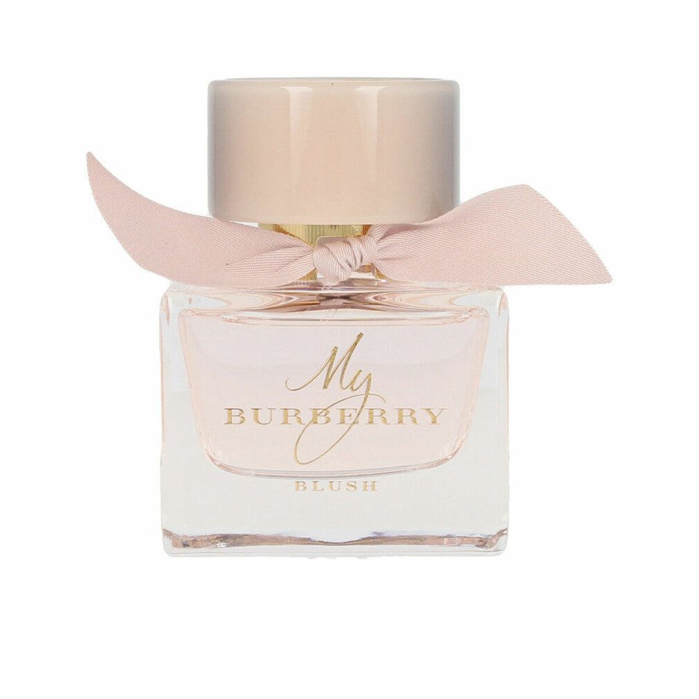 Quadratischer Glasflakon mit rosa Flüssigkeit. Rosa Verschluss und Schleife. Goldfarbener Schriftzug: My Burberry Blush.