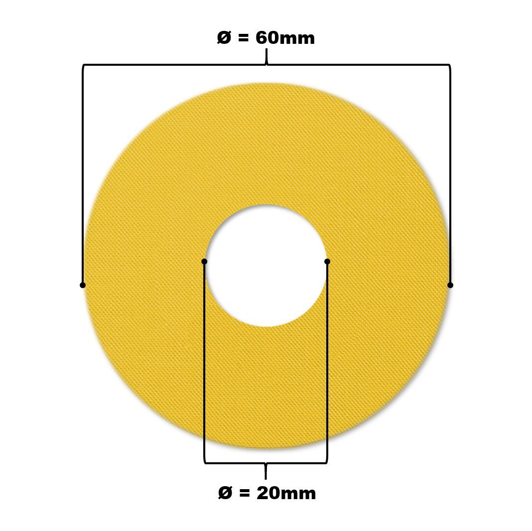 Gelber Katheterpatch mit Loch. Durchmesser 60mm, Loch 20mm. Diagonale Textur.