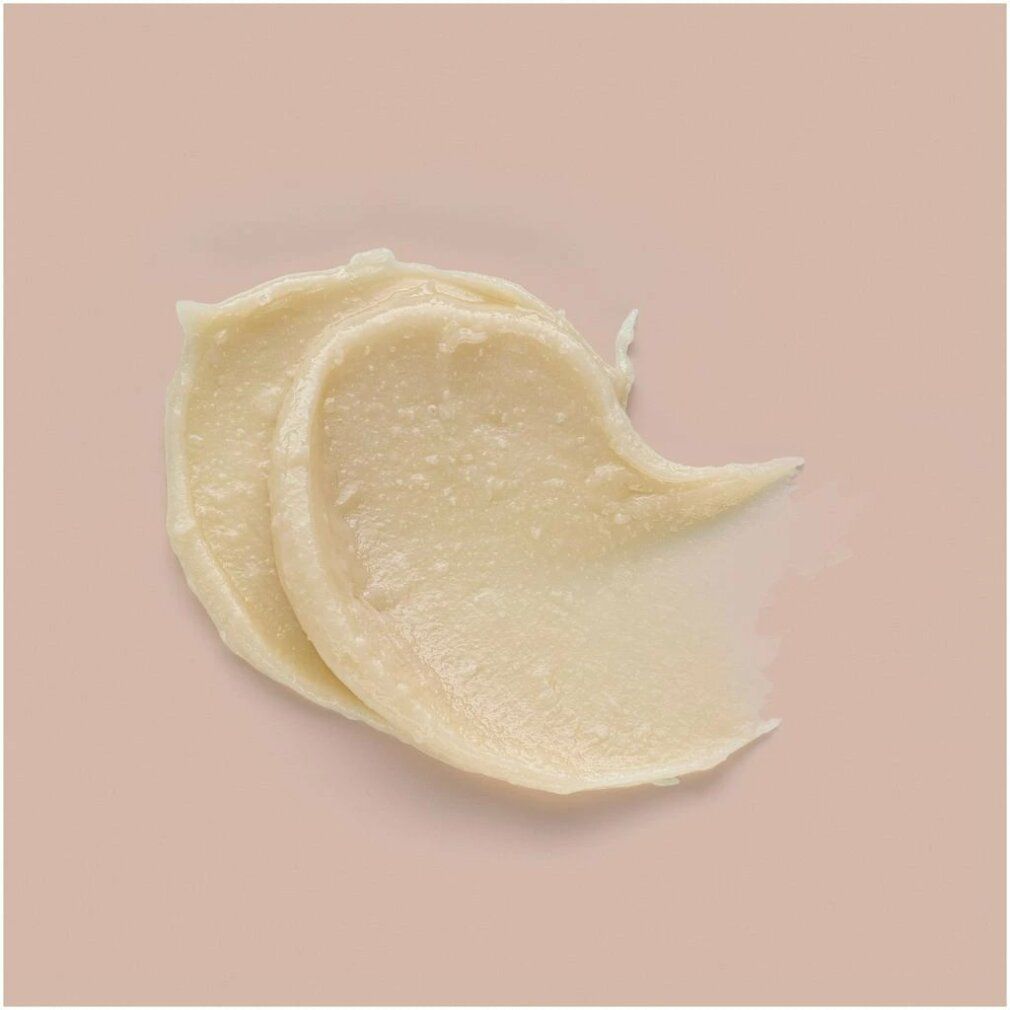 Goldwell Stylesign Texture Defining Wax. Creme-Textur auf rosa Hintergrund. Produkt in cremiger Konsistenz.
