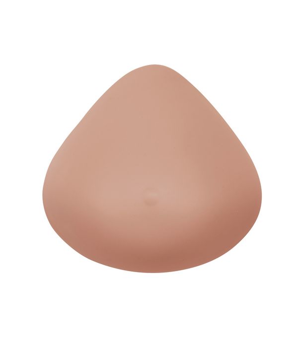 Brustprothese, elfenbeinfarben, tropfenförmig. Kleine Vertiefung in der Mitte. Glatte Oberfläche.