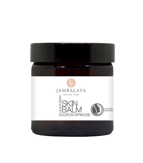 Braunes Glas mit schwarzem Deckel. Auf dem Etikett steht "Jambalaya Skin Balm Kokos-Aprikose".