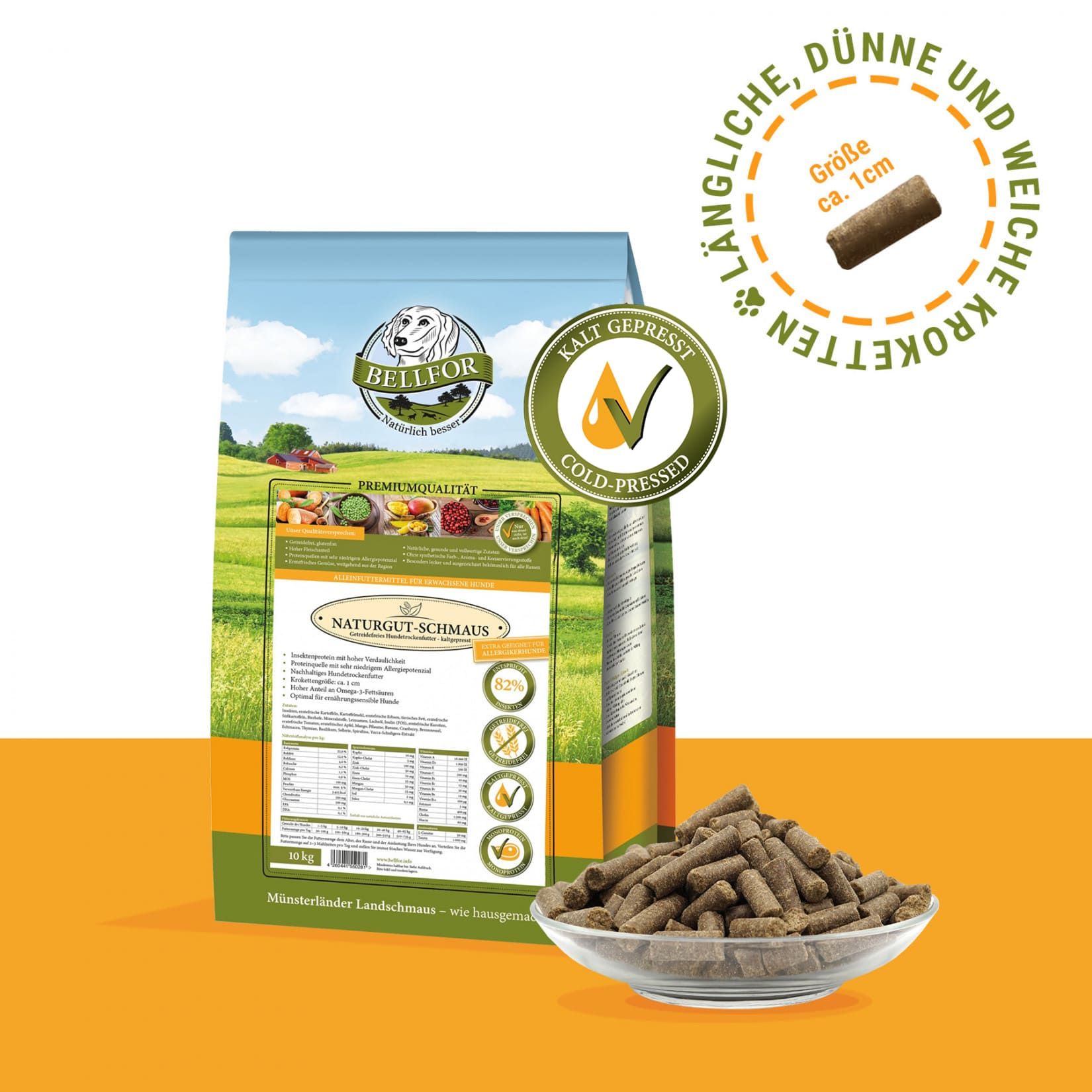 Hundefutter-Beutel und Pellets in Glasschale. Pellets: zylindrisch, braun. Beutel: grün-weiß, Logo. Text: Kaltgepresst.