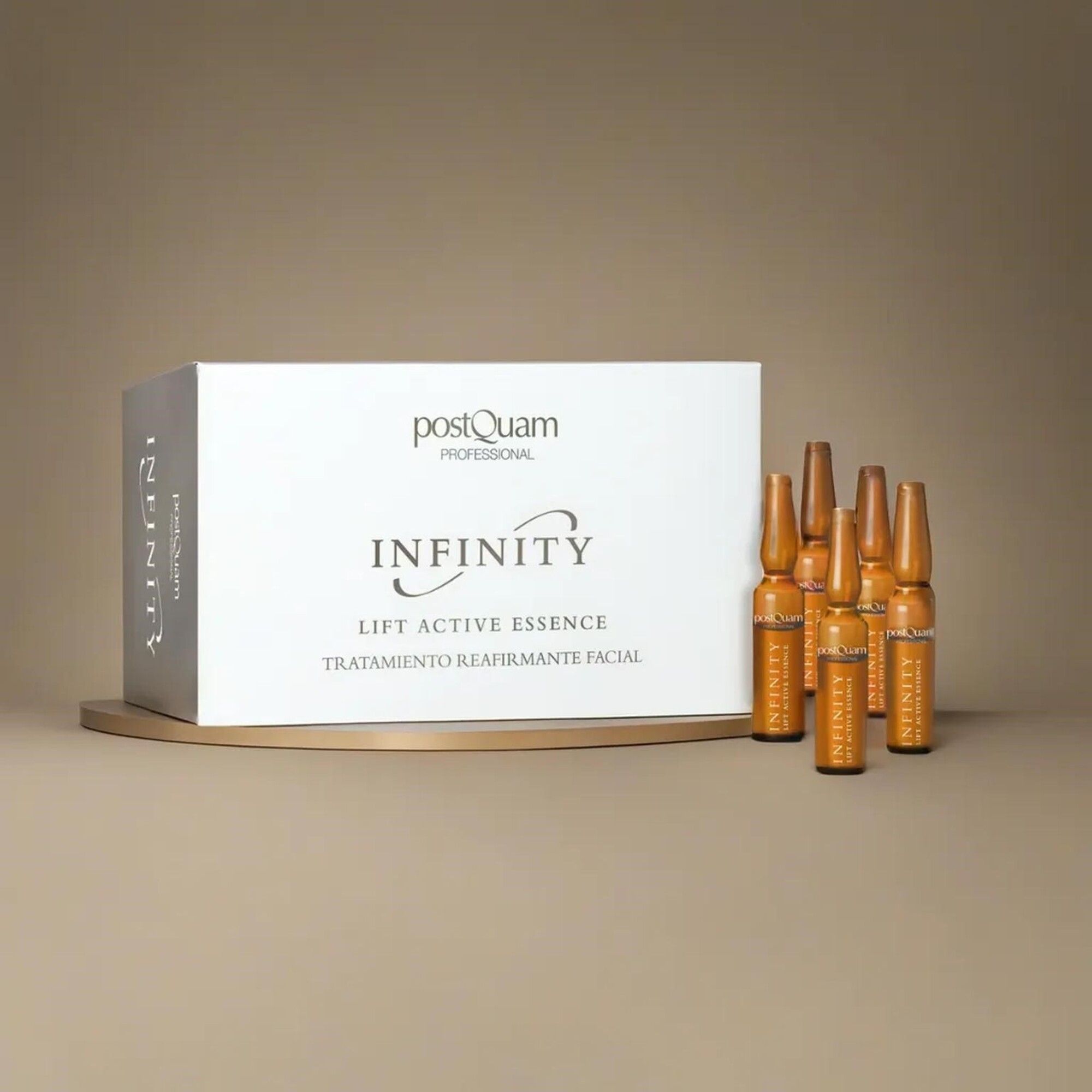 Produktverpackung mit Ampullen. Aufschrift: Postquam, Infinity, Lift Active Essence. Auf Ablage.
