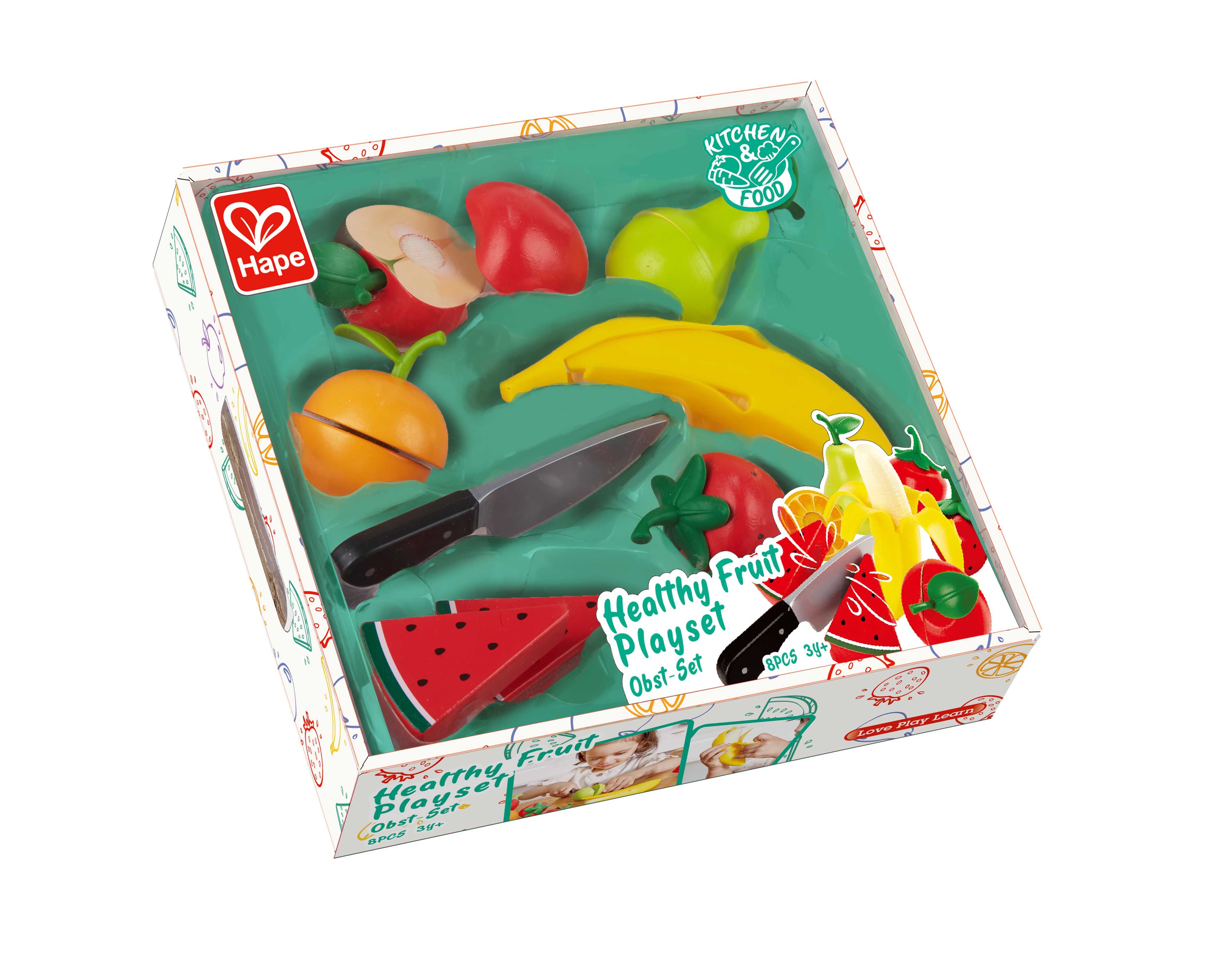 Hape Obst-Set in einer Verpackung. Enthält Spielzeug-Obst, Messer und eine grüne Basis. Aufschrift: Healthy Fruit Playset.