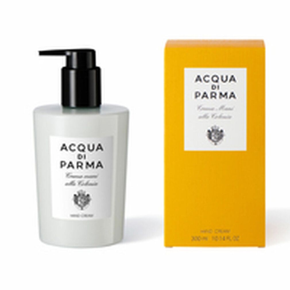 Weißer Spender und gelbe Schachtel. Spender mit schwarzem Pumpkopf. Aufkleber mit Logo und Text: Acqua Di Parma, Crema mani alle Colonia, Hand Cream.
