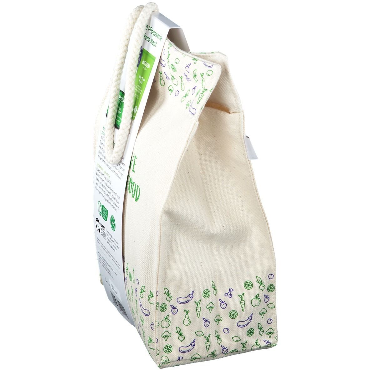 Beige Stofftasche mit Aufdrucken und Anhänger. Aufschrift: SKIN FOOD. Marke: WELEDA. Mit Produktabbildungen.