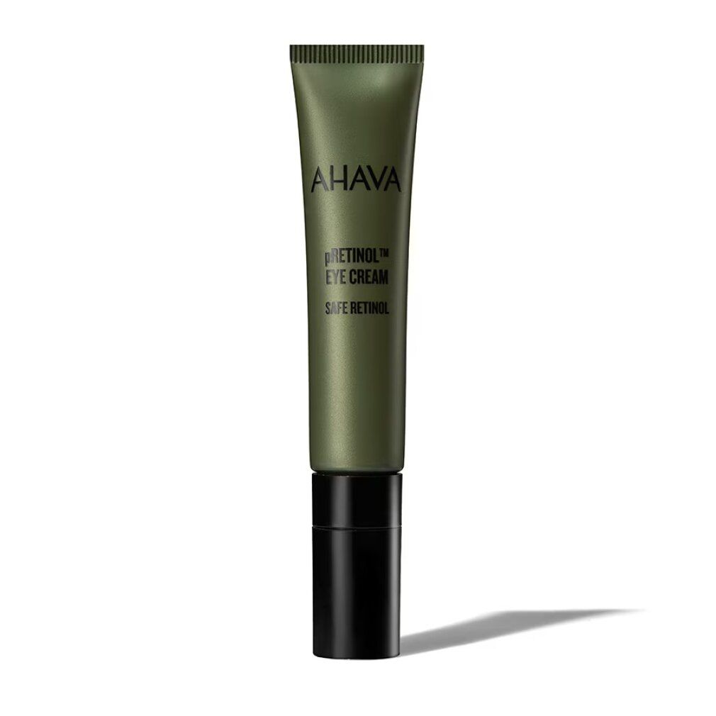 Grüne Tube mit schwarzem Deckel. Aufschrift: AHAVA pREtinol EYE CREAM SAFE RETINOL. Schatten.