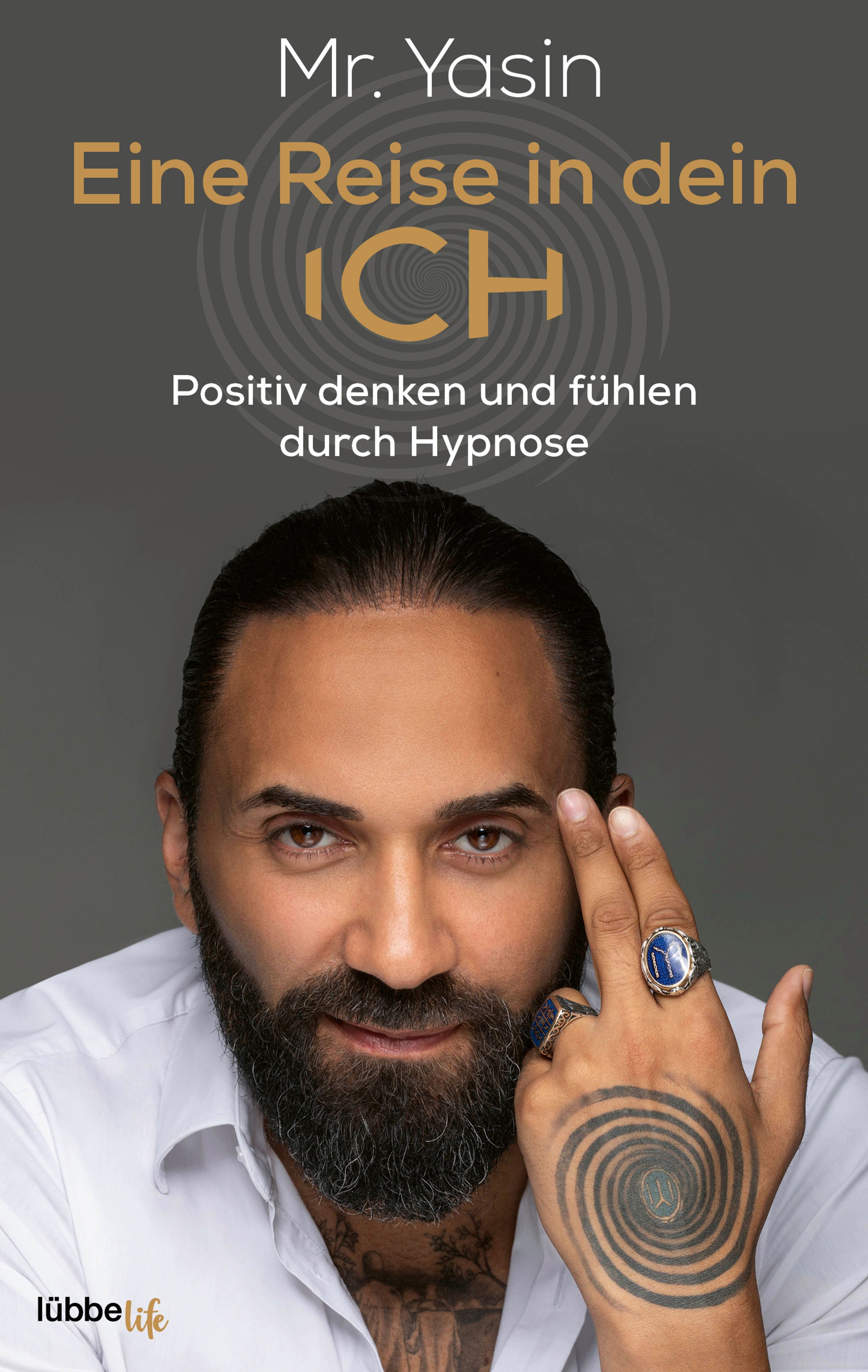 Buchcover mit Titel "Eine Reise in dein Ich". Autor Mr. Yasin. Auf dem Cover ist ein Mann mit Bart abgebildet, der auf seinen Finger zeigt.