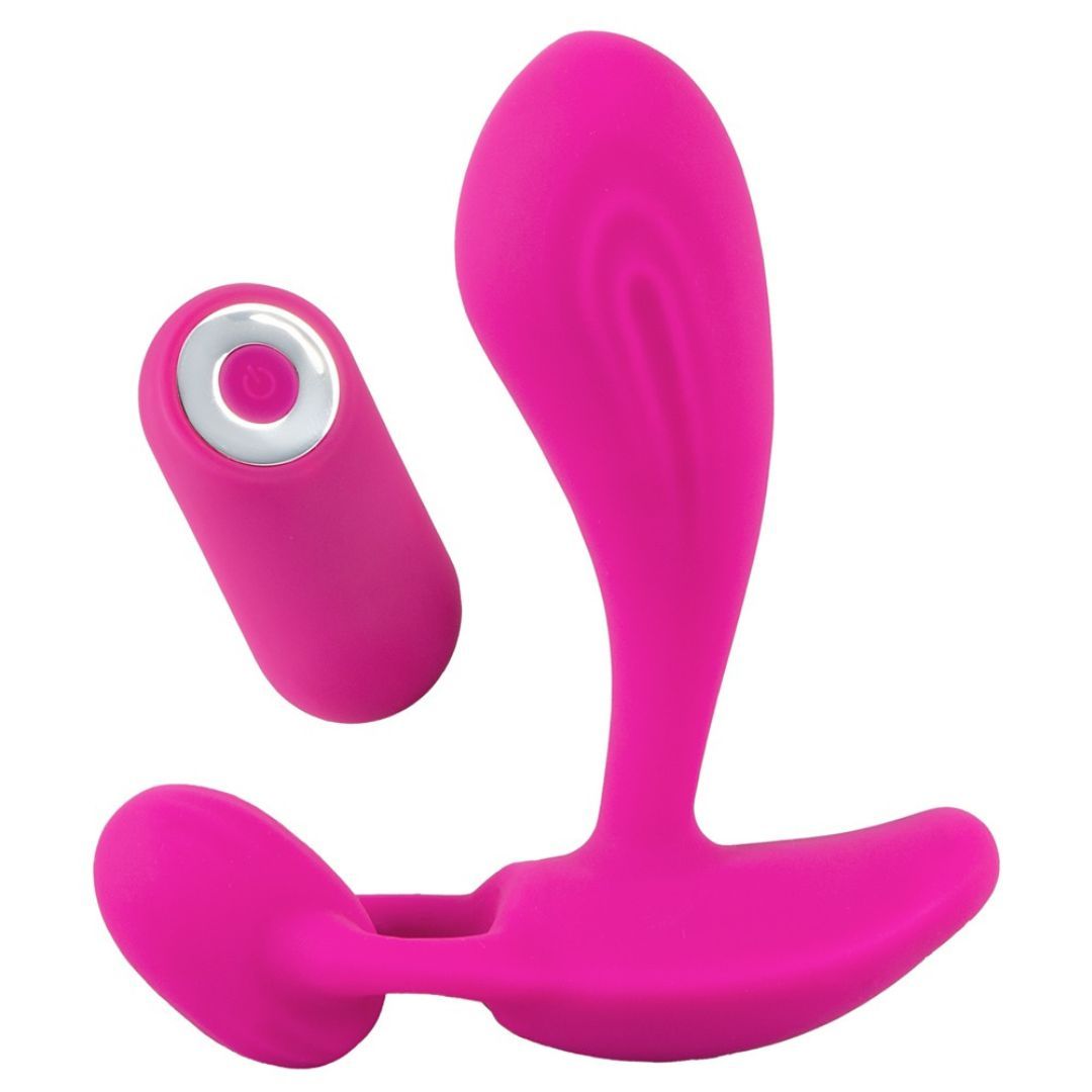 Pinkfarbener Vibrator mit Fernbedienung. Der Vibrator hat eine geschwungene Form mit zwei Enden und einem separaten Fernbedienungsteil.