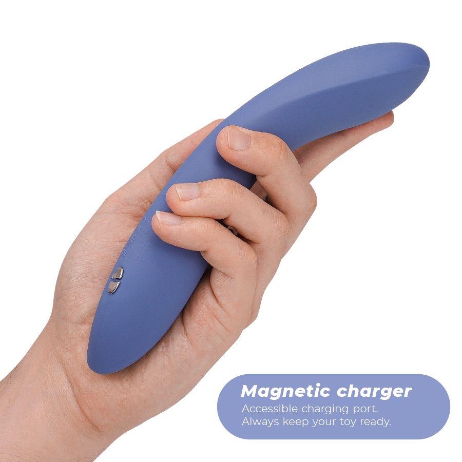 Blaues Vibrationsgerät in einer Hand gehalten. Text: "Magnetic charger".