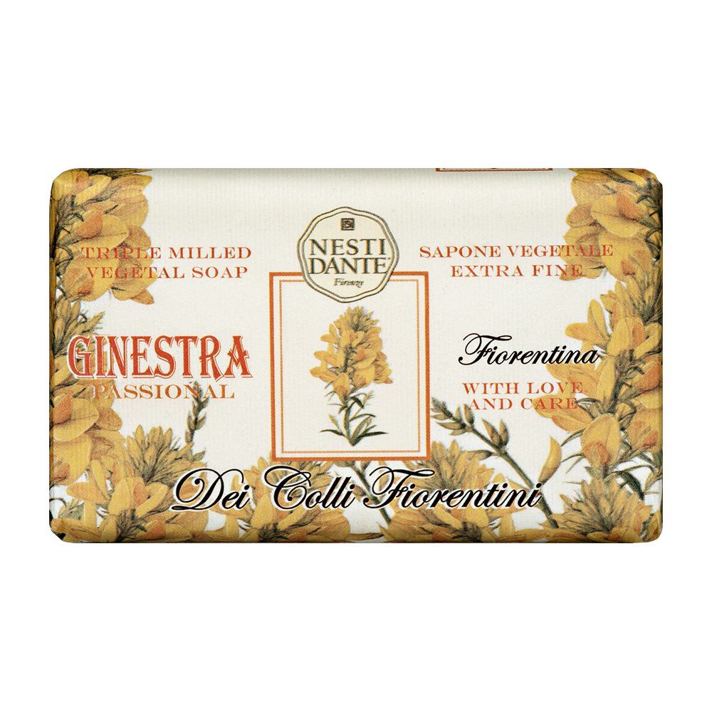 Rechteckige Seife mit floralem Design. Aufschrift: Nesti Dante, Ginestra, Dei Colli Fiorentini. Gelbe Blüten auf weißem Grund.