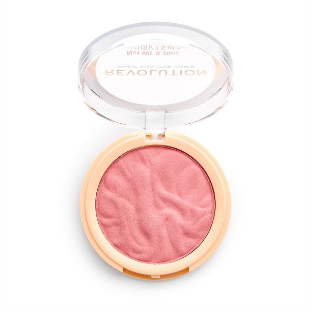 Runder Blush-Kompaktpuder, geöffnet. Rosa Puder in beigem Behälter mit transparentem Deckel. Schriftzug: REVOLUTION MAKEUP REVOLUTION LONDON.