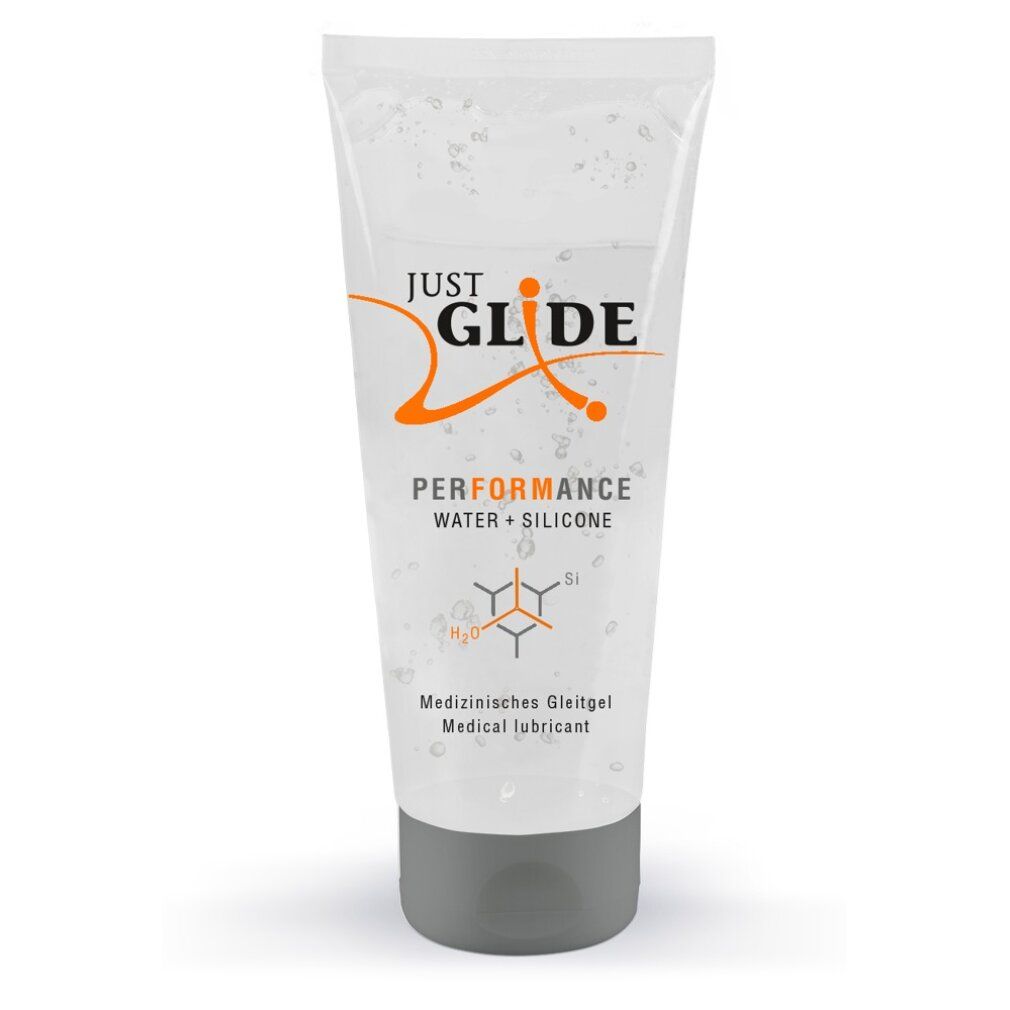 Durchsichtige Tube mit Produkt. Aufschrift: Just Glide Performance, Wasser + Silikon. Grauer Verschluss.