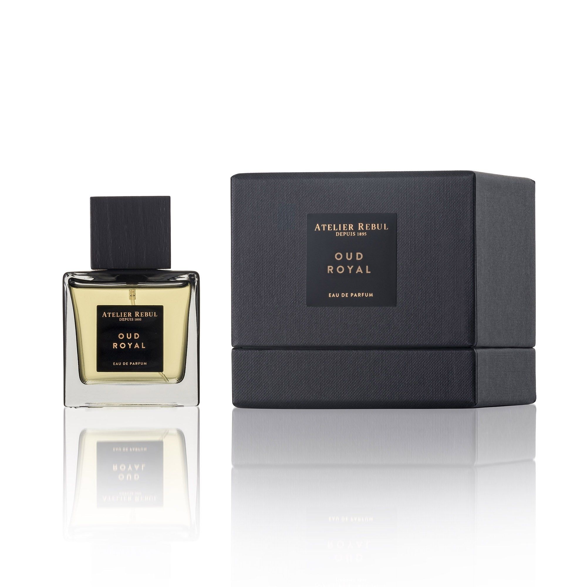 Parfümflakon und schwarze Geschenkbox mit Etikett 'OUD ROYAL'.