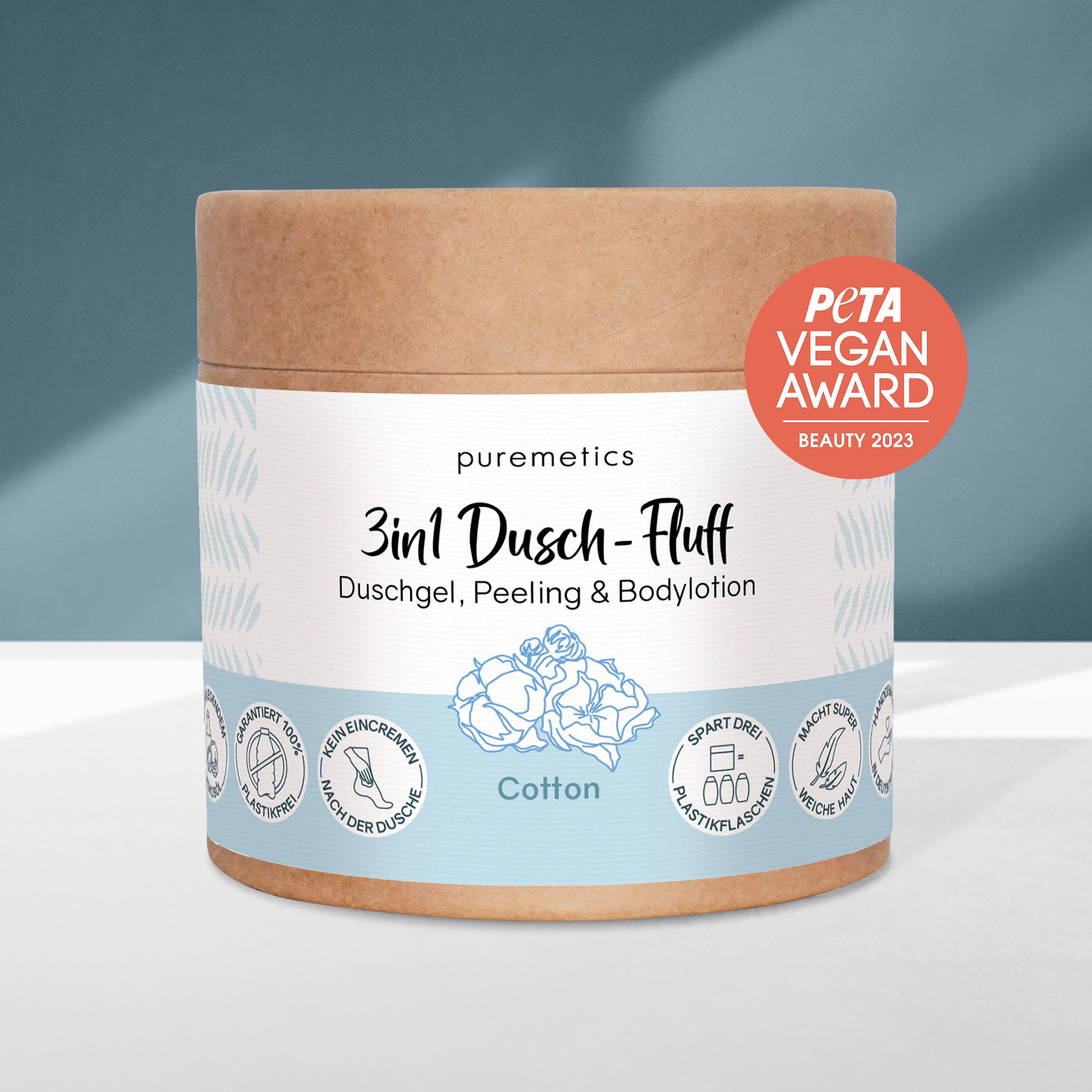 Zylinderförmiger Behälter mit Produktinformationen. PETA Vegan Award. Text: 3in1 Dusch-Fluff, Duschgel, Peeling & Bodylotion.