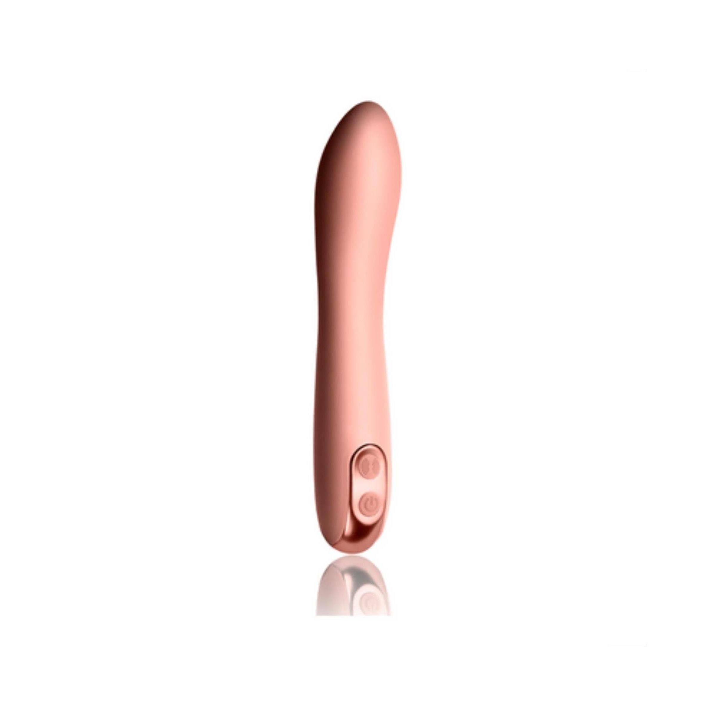 Rosa Vibrator mit zwei Knöpfen. Produkt mit abgerundeter Spitze. Spiegelung des Produkts.