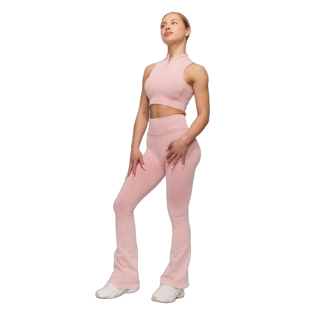 Damen-Leggings in Babyrosa mit hoher Taille und ausgestelltem Bein.