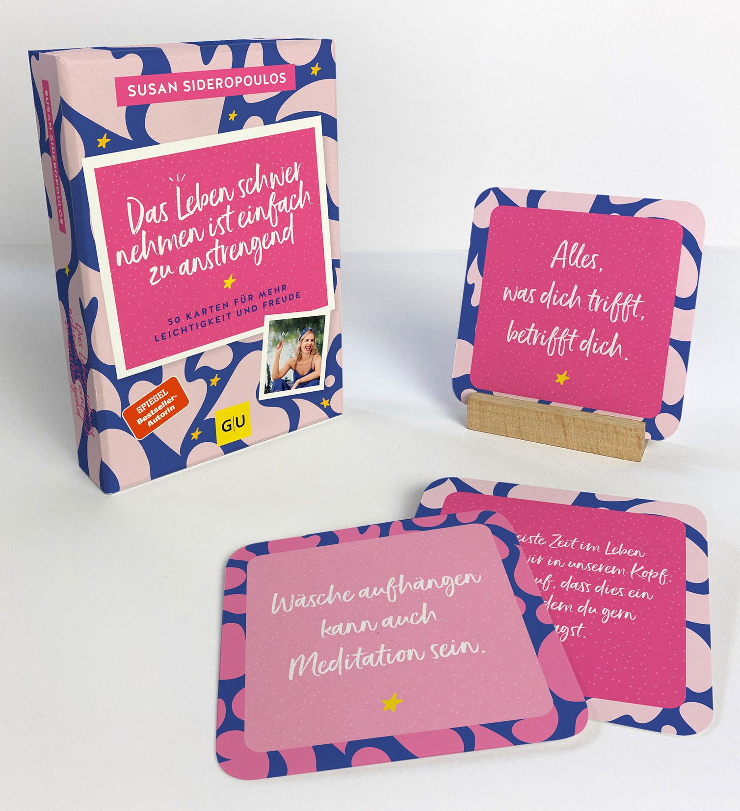 Kartenset mit rosa Karten und Box. Aufschrift: Das Leben schwer nehmen ist einfach zu anstrengend. GU-Verlag.