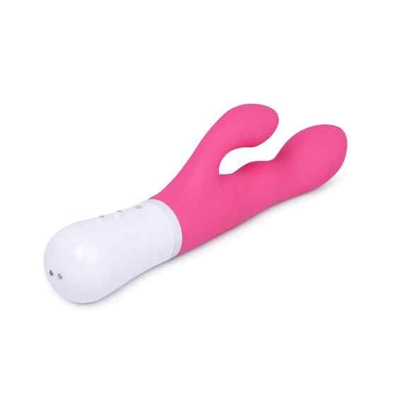 Rosa Vibrator mit weißem Sockel. Zwei Ausbuchtungen. Drei kleine Löcher auf dem Sockel.
