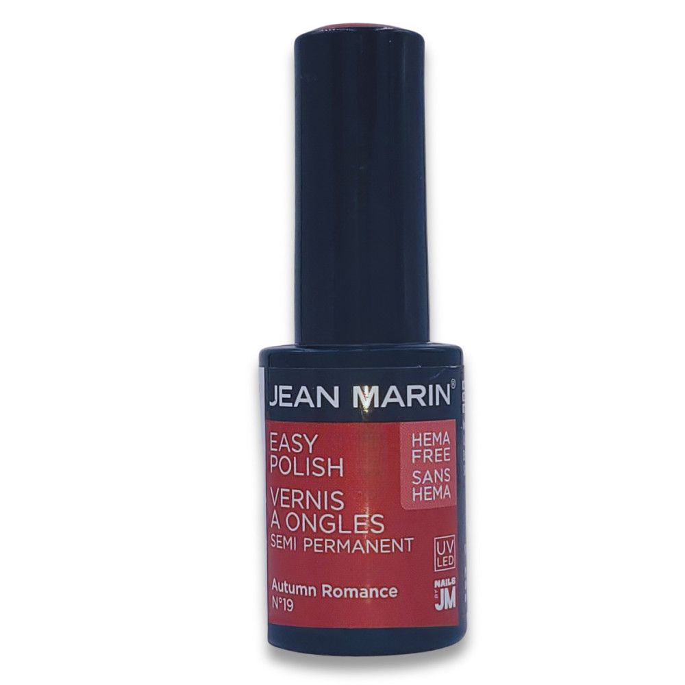 Nagellackflasche von Jean Marin. Schwarzer Deckel, rotes Etikett mit Produktinformationen. "HEMA FREE" und "Autumn Romance" sind sichtbar.
