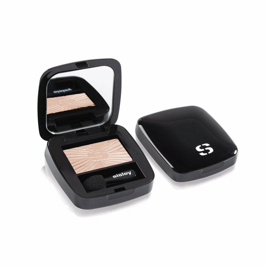 Geöffnete schwarze Sisley Lidschatten-Kompaktpuder. Spiegel, Applikator und Lidschatten. Deckel daneben.