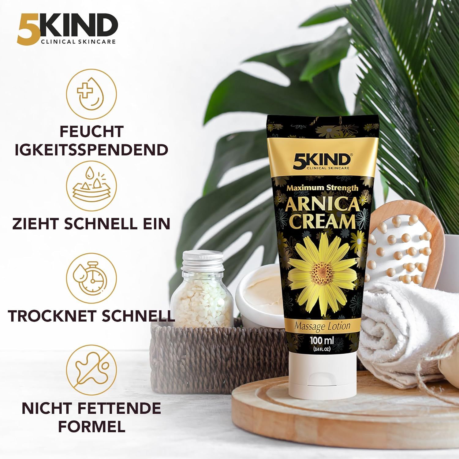 Creme-Tube mit gelbem Etikett. Text: 5kind, Arnica Cream, Massage Lotion. Zusätzliche Symbole und Text über Eigenschaften.