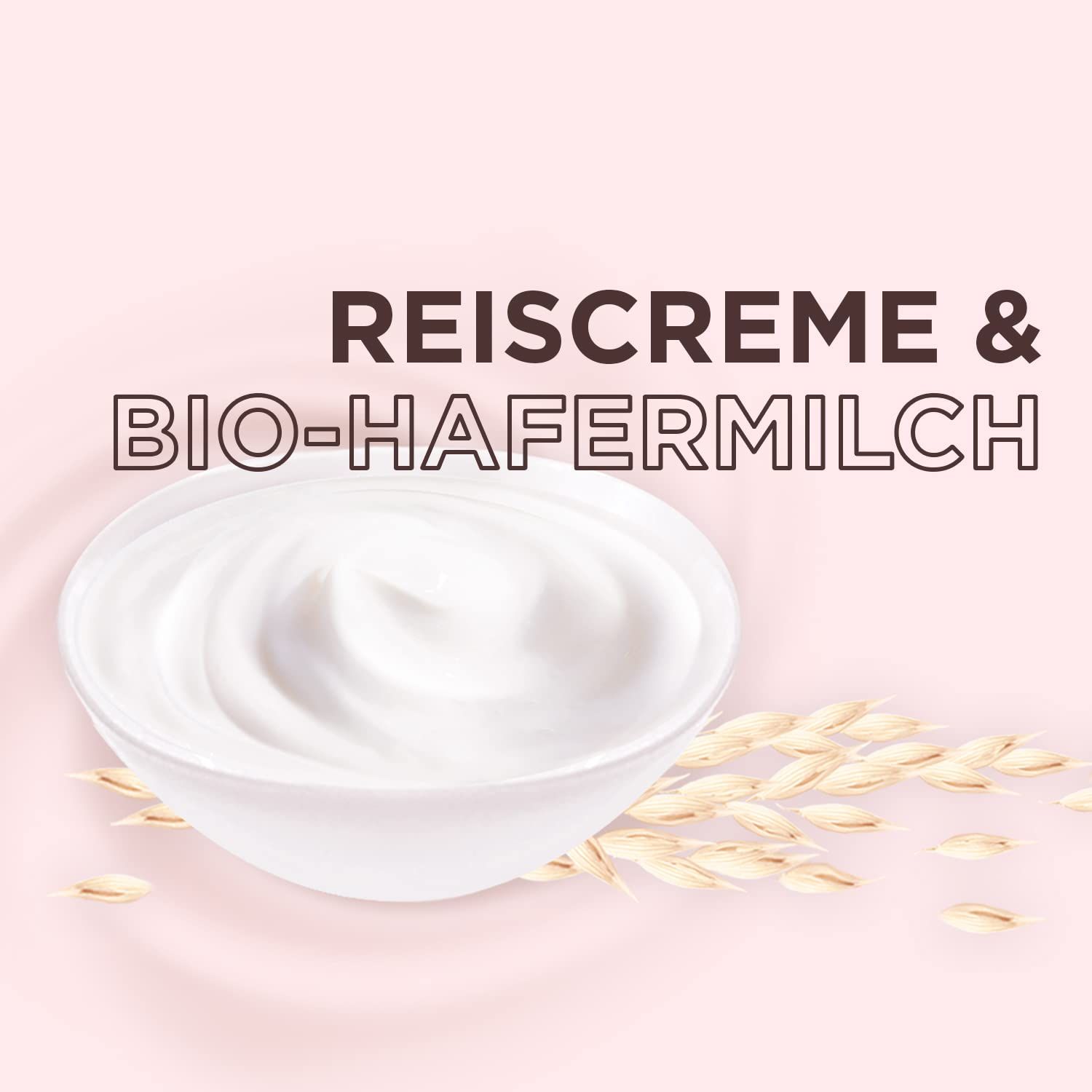 Weißes Schälchen mit cremiger Substanz, daneben Haferähren. Text: Reiscreme & Bio-Hafermilch. Hintergrund: Rosa.
