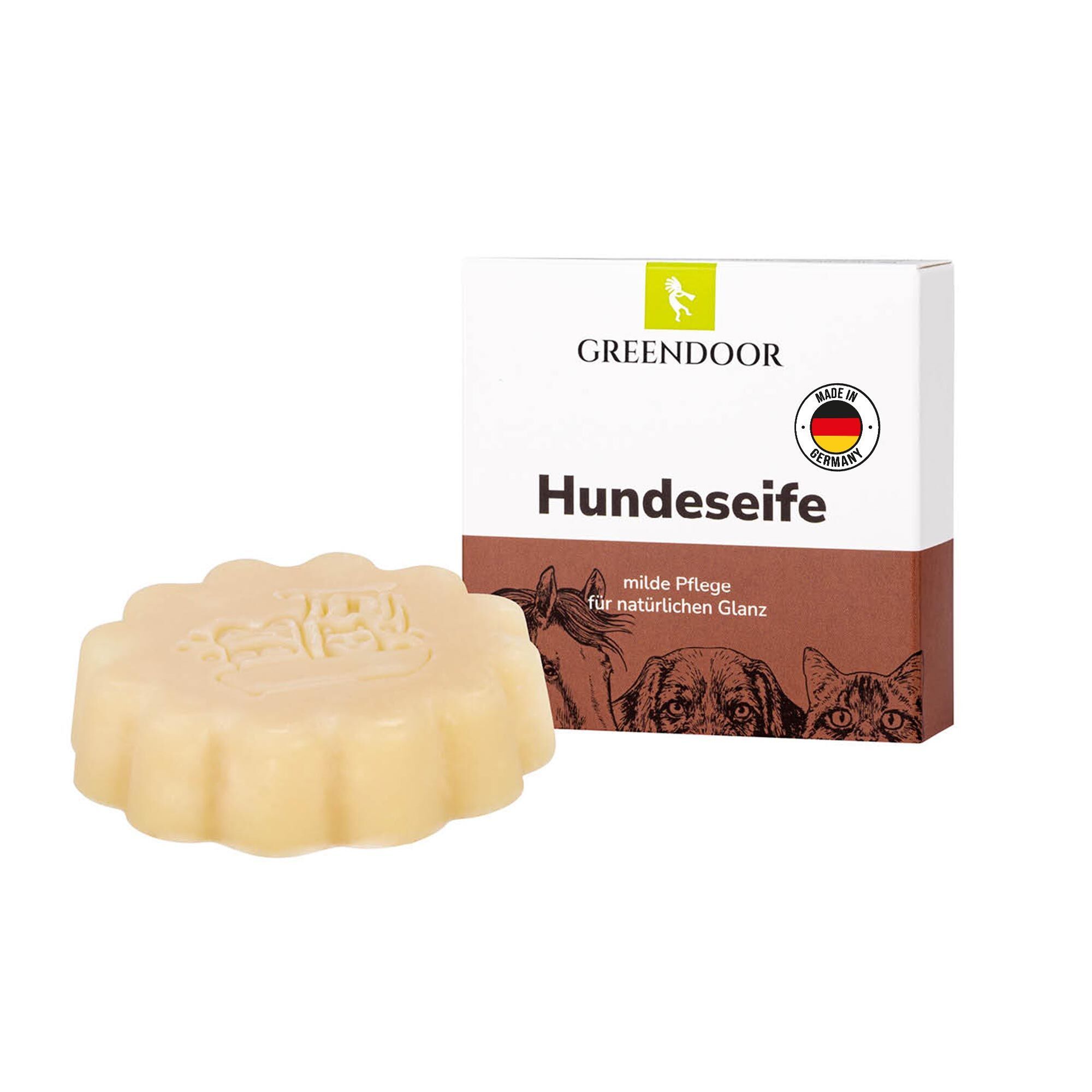 Hundeseife in Blumenform mit Verpackung. "GREENDOOR Hundeseife" und "Made in Germany" sind sichtbar.