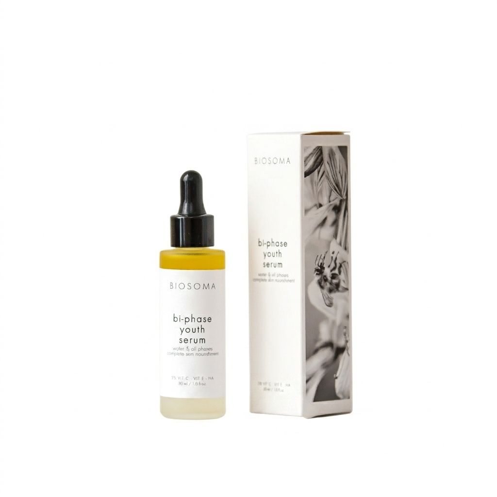 BIOSOMA Zweiphasen Anti-Aging Gesichtsserum mit Vitamin C in Glasflasche mit Pipette und Kartonverpackung.