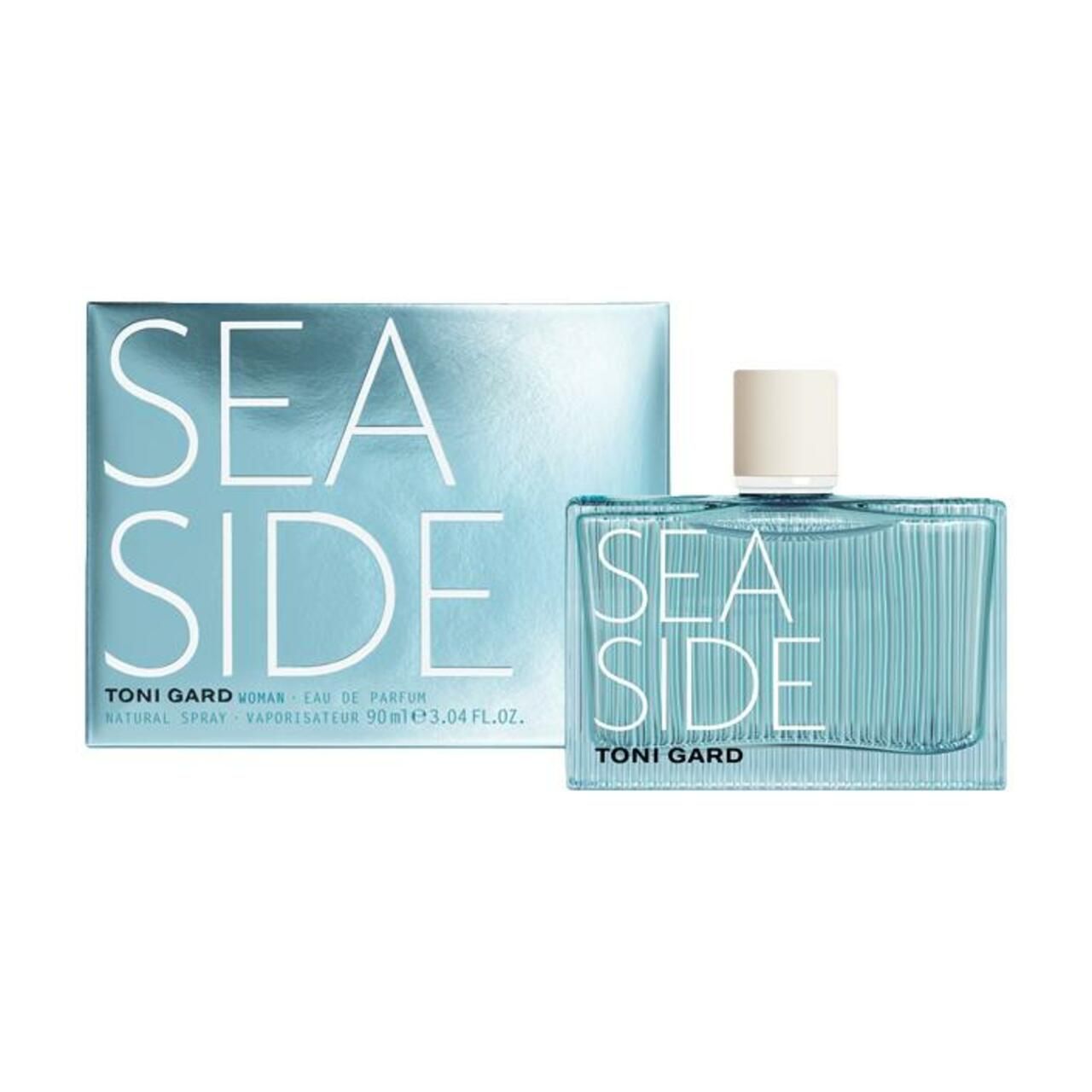 Hellblaues Parfumflakon und Schachtel. Aufschrift SEA SIDE und TONI GARD. Flakon mit weißem Verschluss. Schachtel mit Produktinformationen.