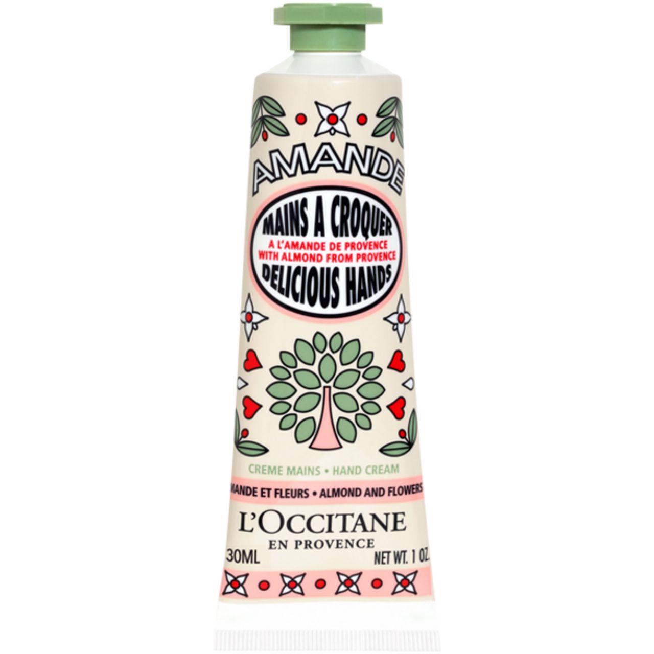 Creme-Tube mit floralem Design. Text: AMANDE, MAINS A CROQUER, DELICIOUS HANDS, L'OCCITANE. Grün-weiße Farbgebung. 30ml.