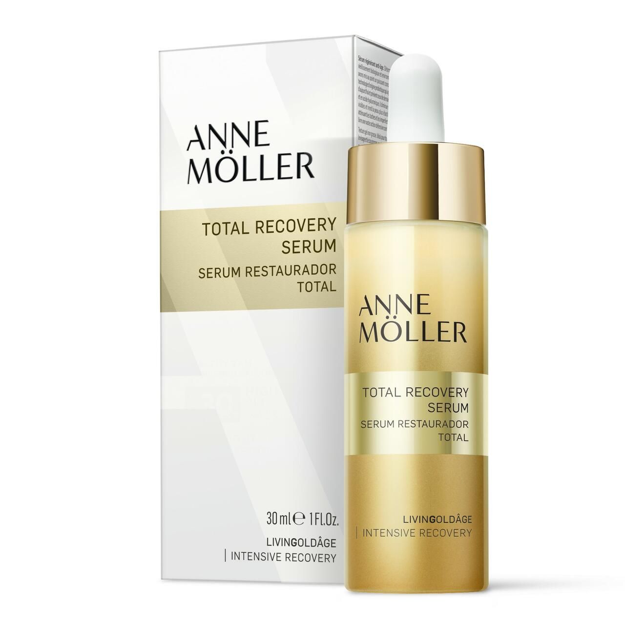 Anne Möller Total Recovery Serum. Flasche und Verpackung. Goldfarbene Flasche mit Pipette, weißer Deckel. Verpackung mit Logo und Produktnamen.