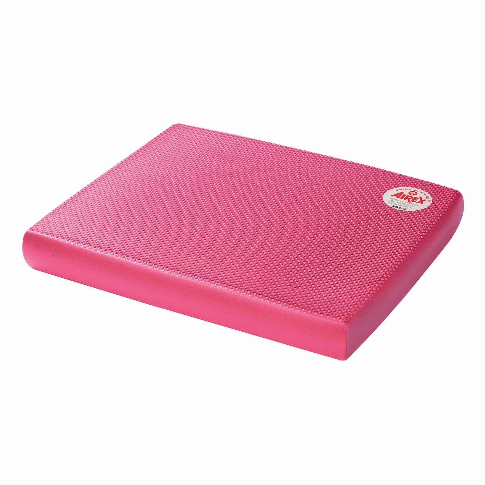 Rosa Balance-Pad. Rechteckige Form mit strukturierter Oberfläche. Abgerundete Kanten. Airex-Logo auf der Ecke.