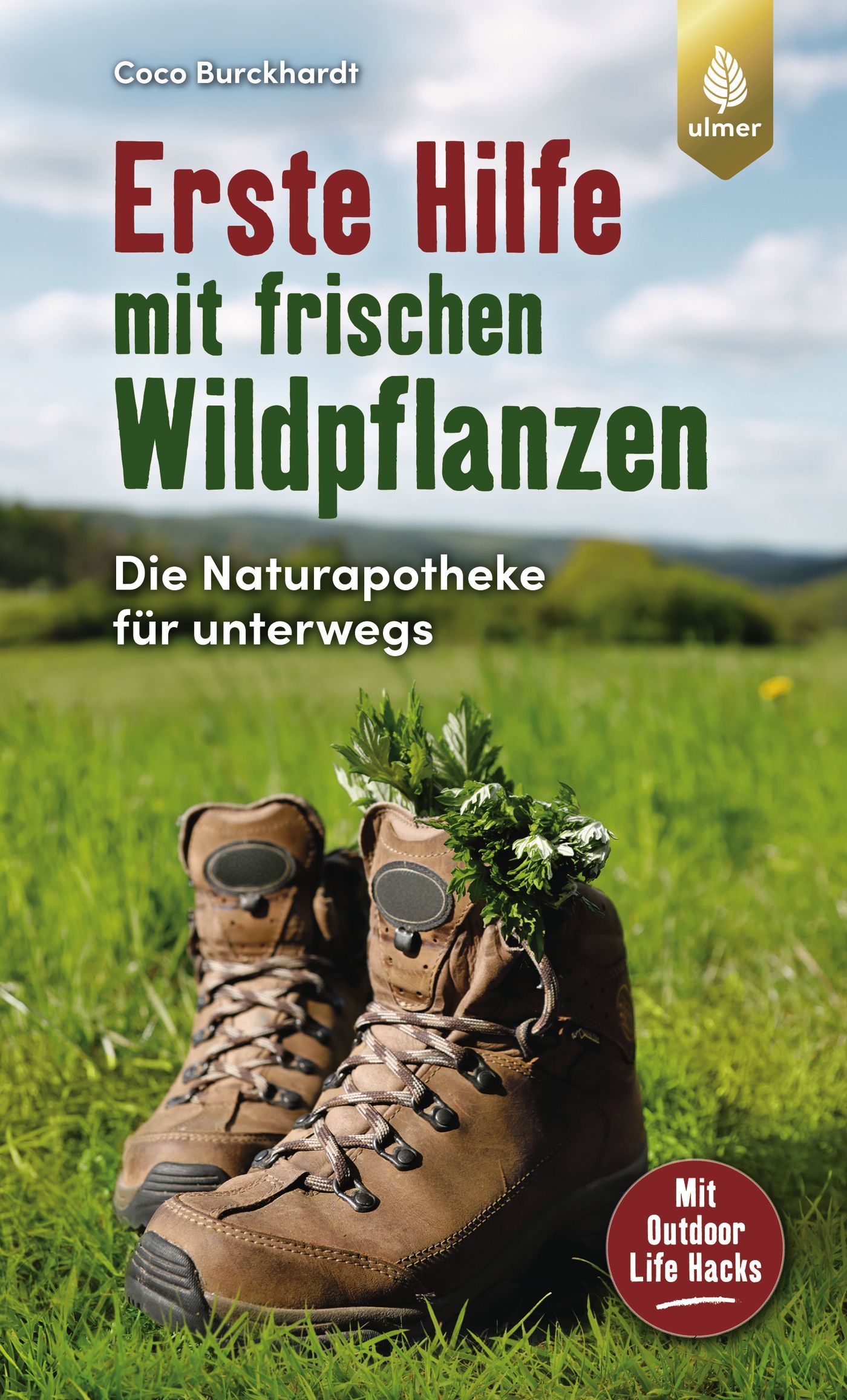 Buchcover mit Titel "Erste Hilfe mit frischen Wildpflanzen". Braune Wanderschuhe mit Pflanzen auf einer Wiese. Verlag Ulmer.