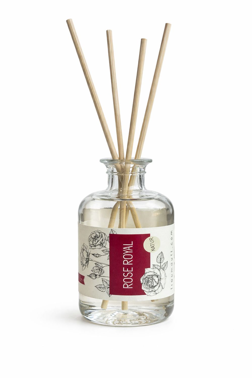 Glasflakon mit Flüssigkeit und Holzstäbchen. Etikett mit Aufschrift Rose Royal und floralem Muster. Natur-Logo.