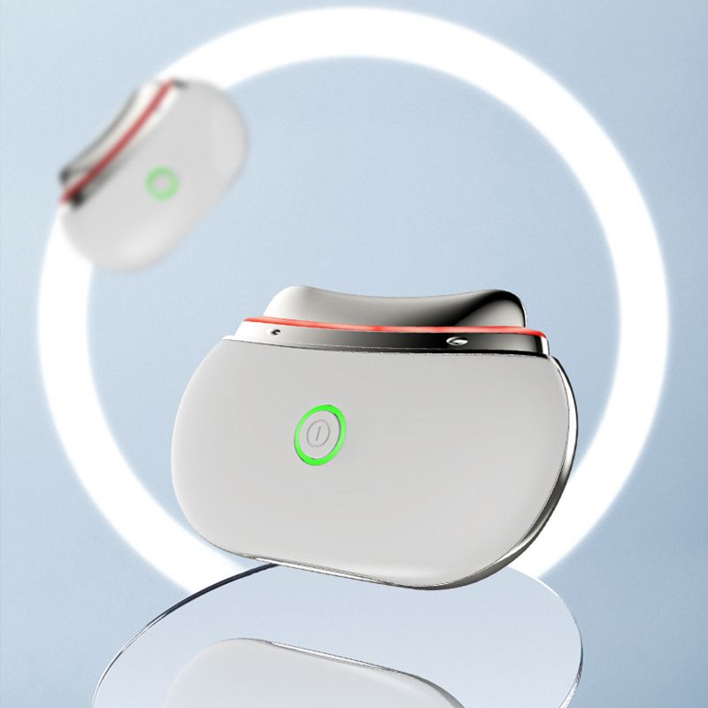 Zwei weiße LED Gua Sha Gesichtslifting-Therapiegeräte mit silberner Umrandung und grünem Einschaltknopf, vor hellem Hintergrund.