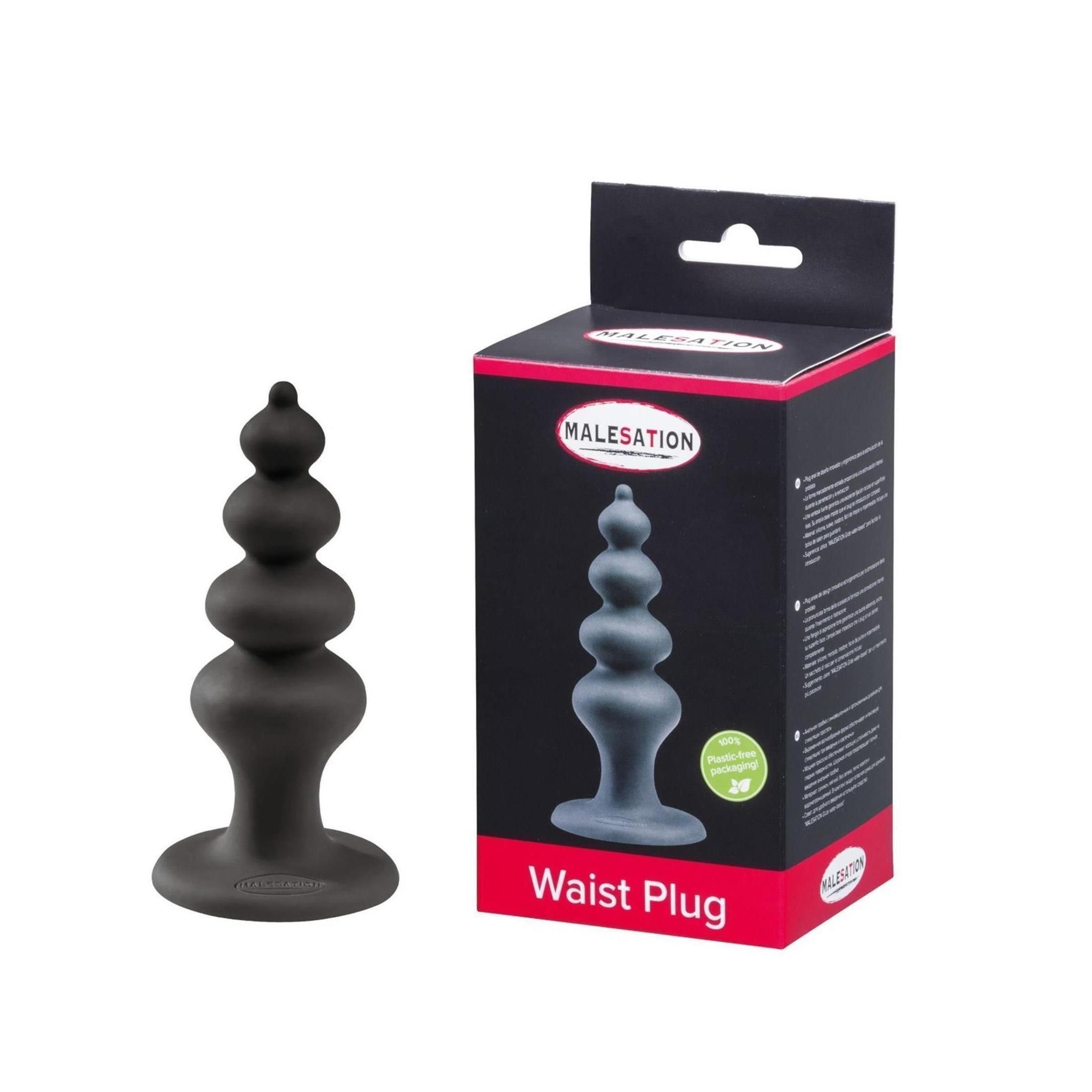 Schwarzer Waist Plug neben Verpackung. Verpackung mit Produktabbildung und Schriftzug MALESATION Waist Plug.