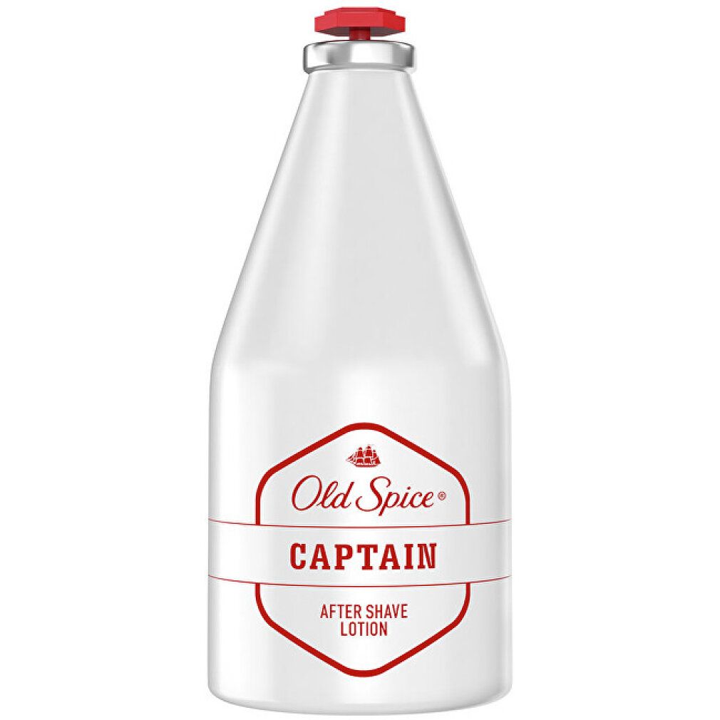 Weiße Flasche mit roter Kappe. Aufschrift: Old Spice Captain After Shave Lotion.