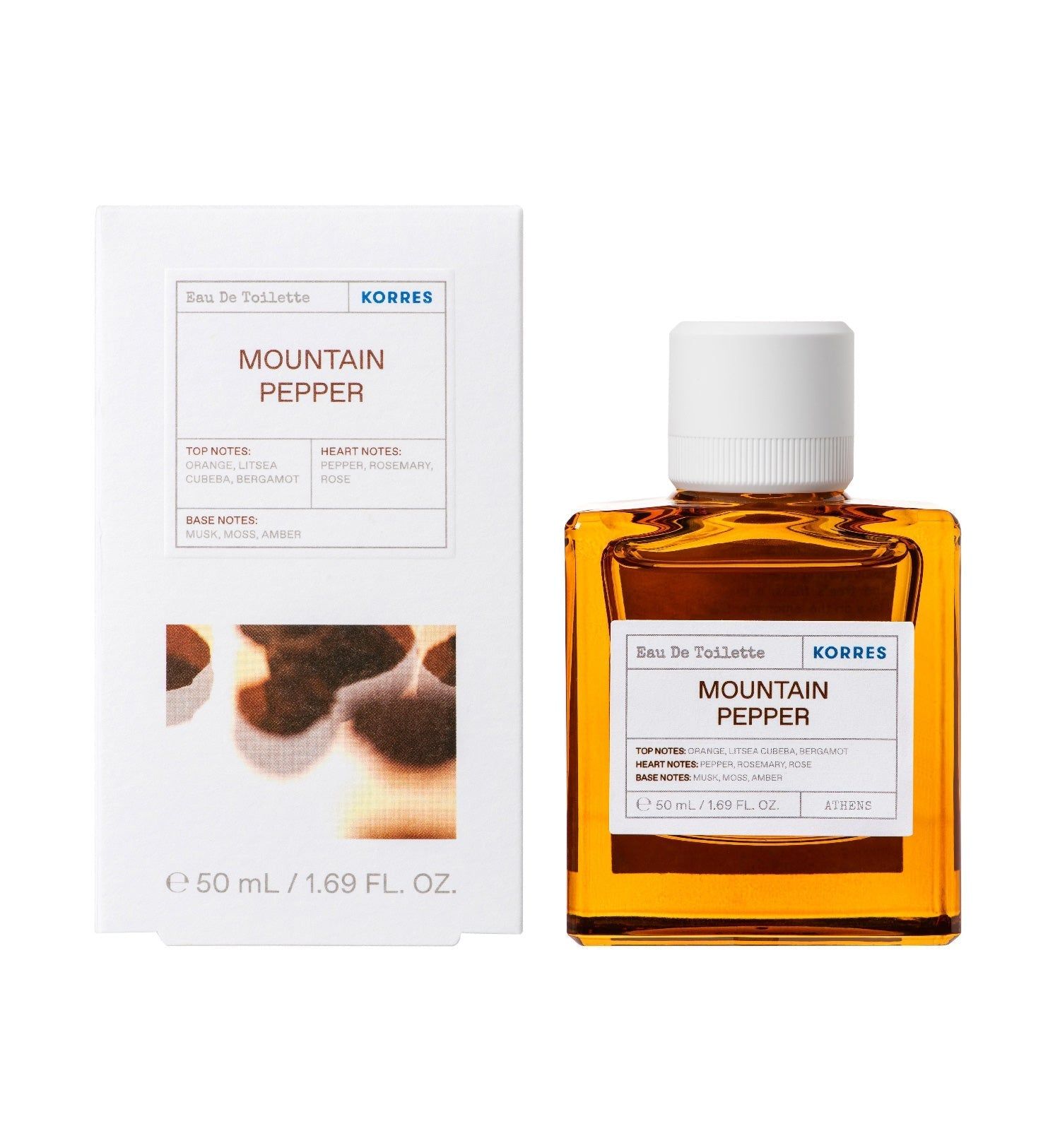Flakon und Verpackung von Eau de Toilette. Aufschrift: Mountain Pepper. Flakon quadratisch, bernsteinfarben. Verpackung weiß mit Produktinformationen.
