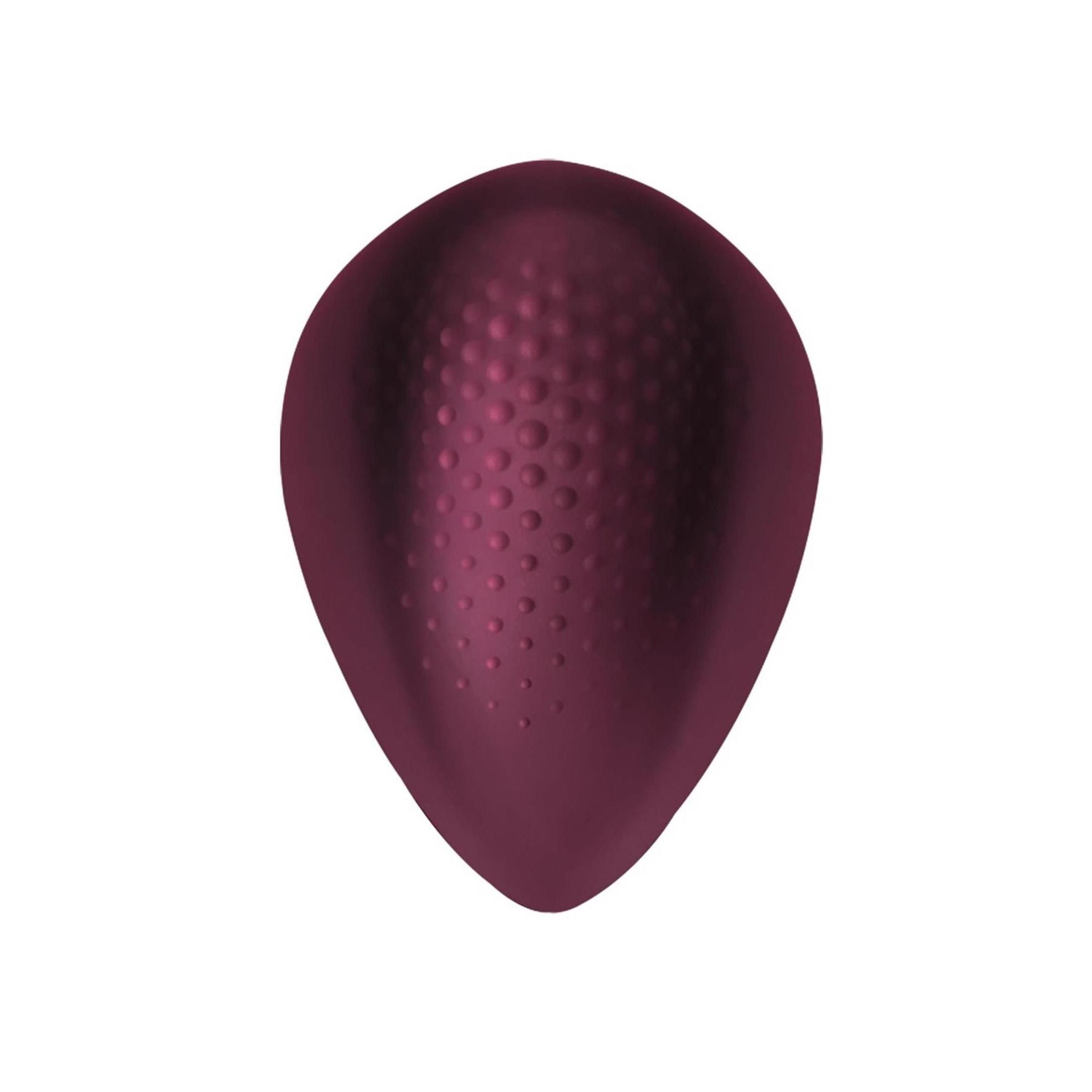 Ei-förmiges Produkt, dunkelrot. Oberseite mit erhabenen Punkten. Glatte Oberfläche.