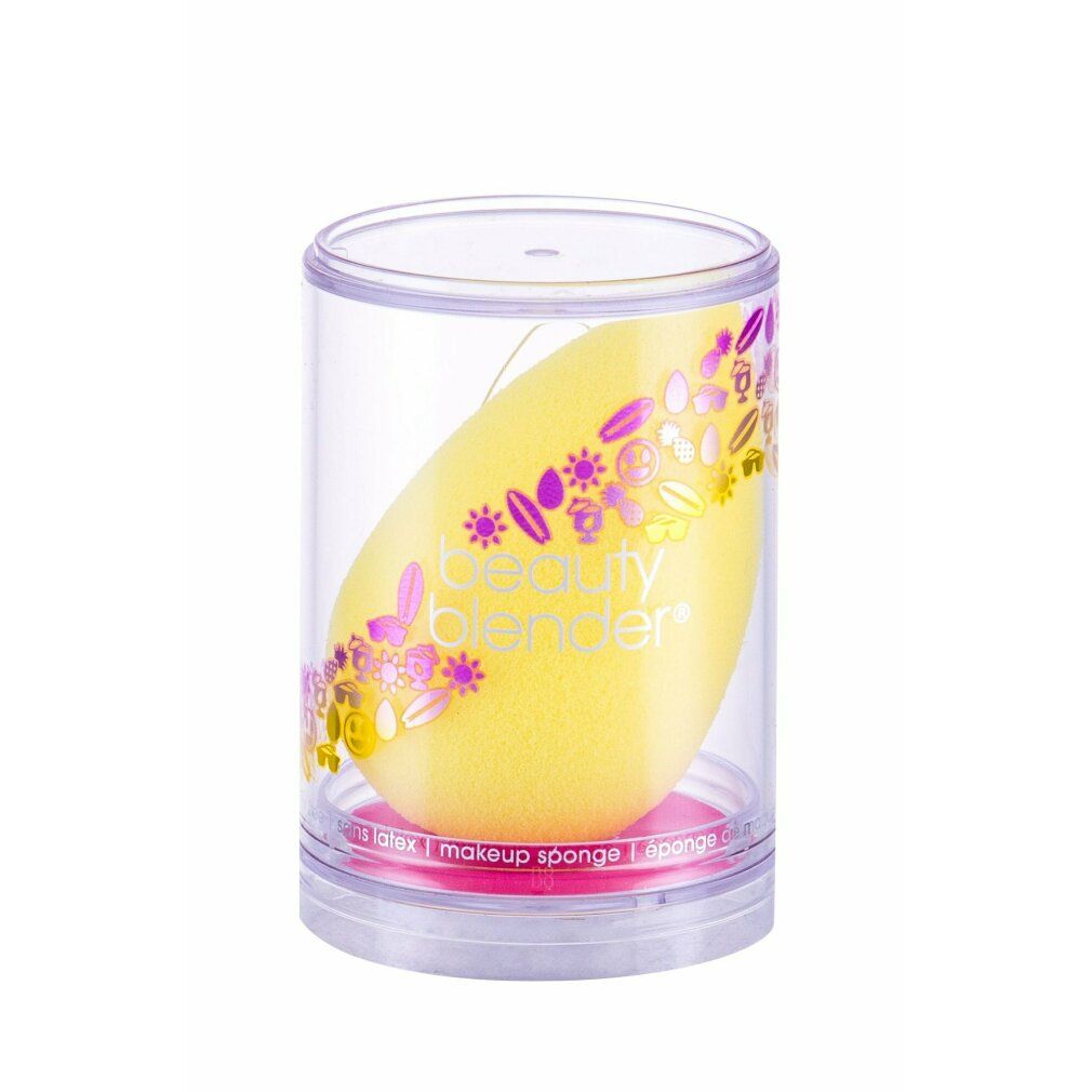 Gelber beautyblender Joy in transparenter Hülle. Aufgedruckter Schriftzug und florales Muster. Ei-Form.