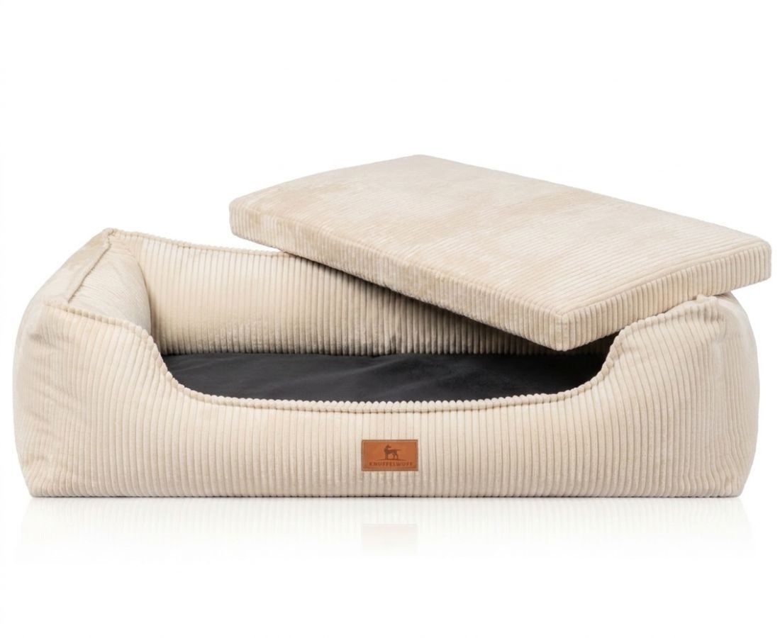 Beiges Hundebett aus Cord mit abnehmbarem Kissen.