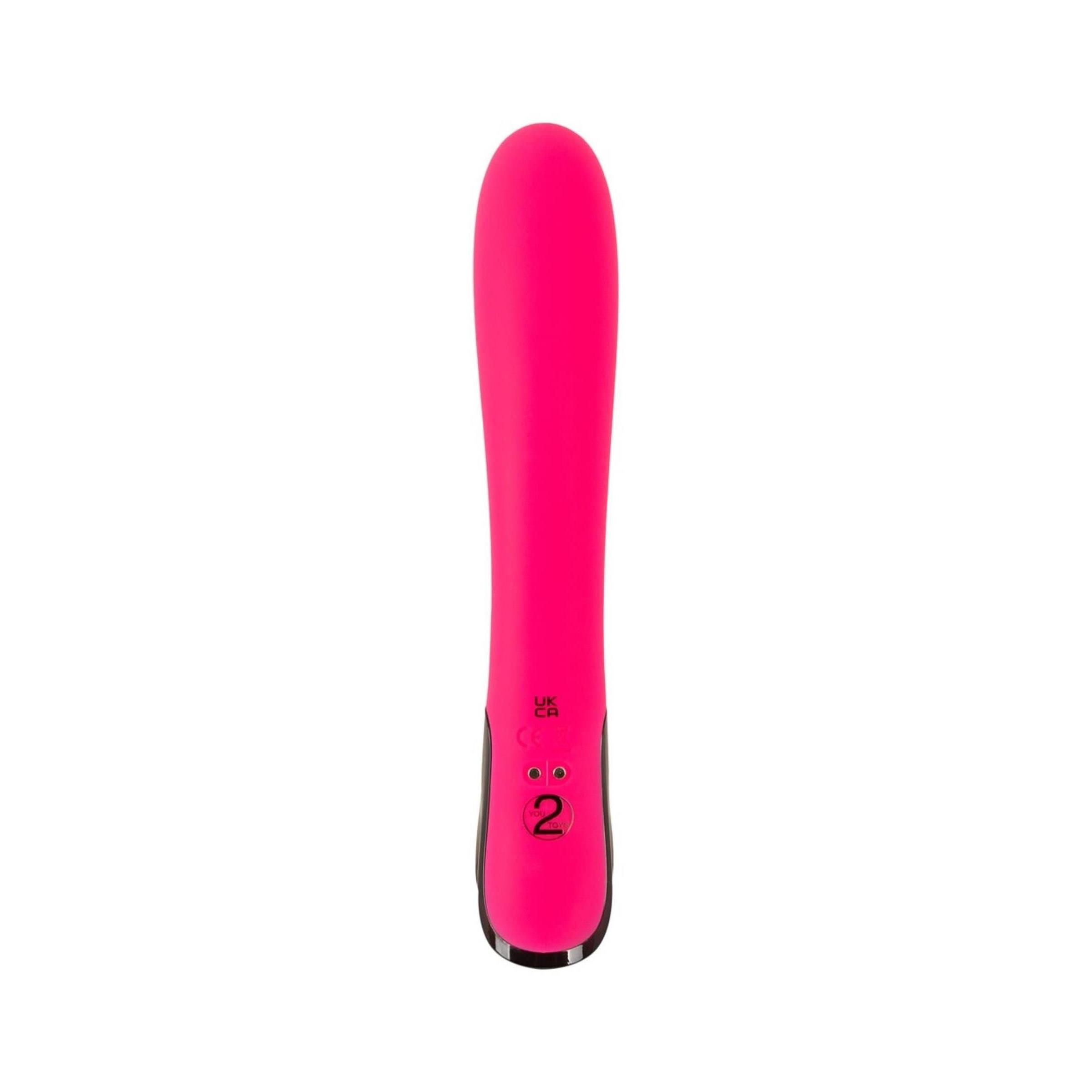 Pinkfarbener Vibrator mit schwarzem Ende. Zeigt die Intensität 2 an. Auf weißem Hintergrund.