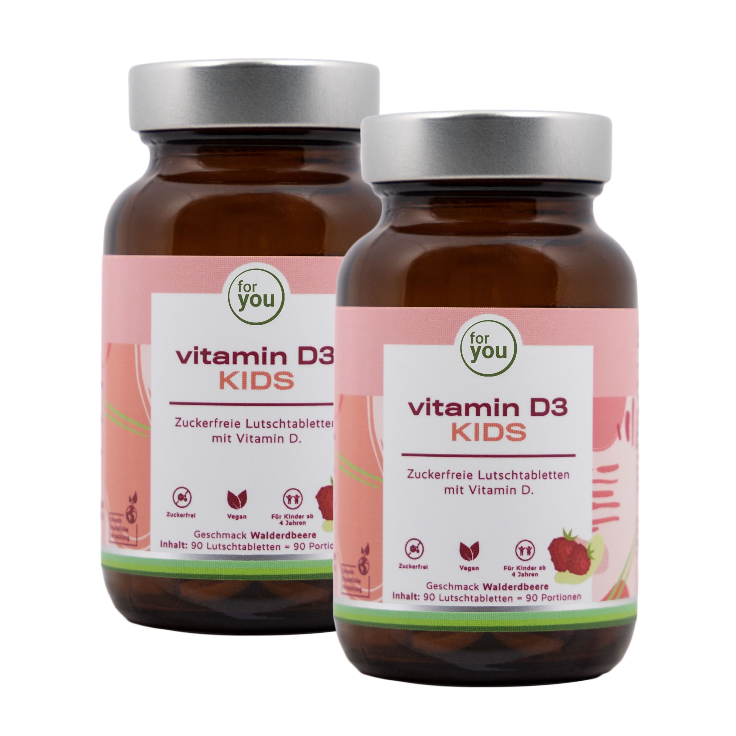 Zwei Flaschen "for you Vitamin D3 KIDS" Lutschtabletten. Braune Glasflaschen mit silbernen Deckeln und rosa Etiketten. Text: Vitamin D3 KIDS.