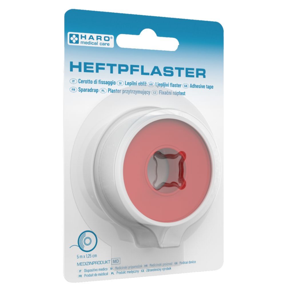 Rol hechtpleister in blisterverpakking. Witte kunststof houder met rode kern. Opschrift: HEFTPFLASTER, HARO medical care.